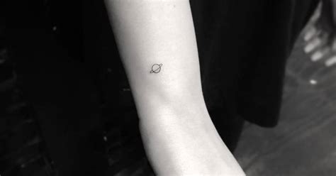 Tiny Saturn Tattoo On The Wrist