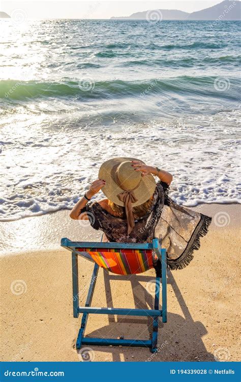 Woman Sitting On A Chair At The Beach Stock Photo Image Of Lifestyle Girl