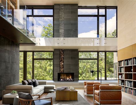 Spacious Double Height Living Room With Massive Windows And Bookshelves