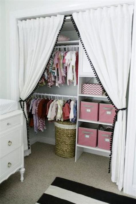 Hubby cut a few inches off the board to get the right height and left about an inch or so on the top so he could put the rollers on the door. {Nursery Closet Organization} Easy DIY Baby Closet ...