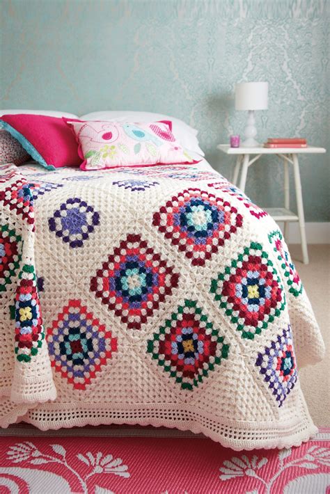 Crocheted Bedspread With Different Size Granny Squares On Cream Base