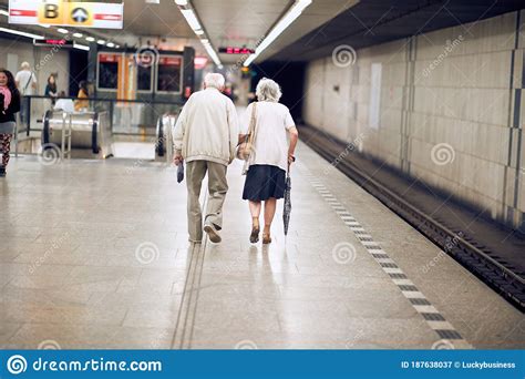Older Happy Couple Walking Together On Subway Stock Image Image Of