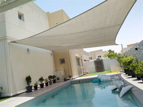 Shade Sail Installed Over A Swimming Pool The Shading Company Dubai