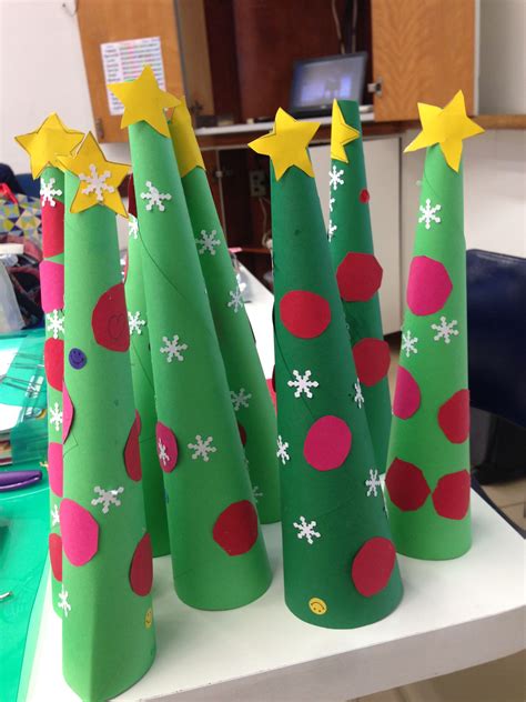 Three Christmas Trees Made Out Of Construction Paper