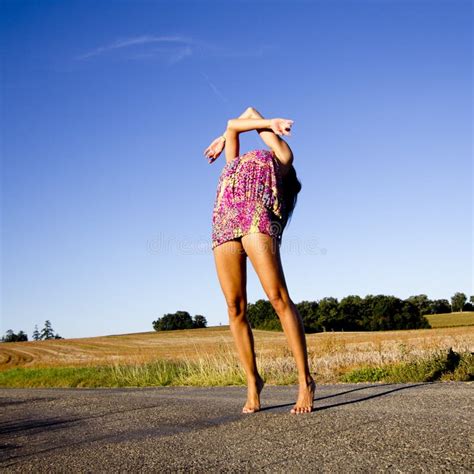 Supple Young Dancer Does The Splits On A Big Stone Block Stock Image
