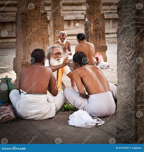 Hindu Brahmin With Religious Attributes Blessing People At Meenakshi