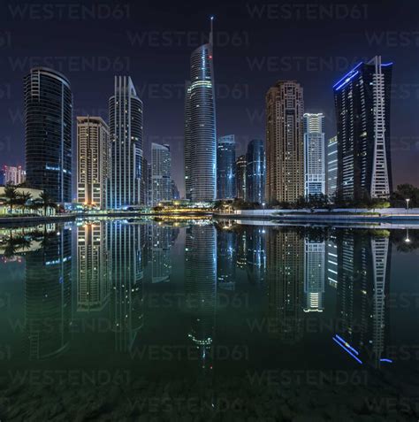 Cityscape Of Dubai United Arab Emirates At Night With Illuminated