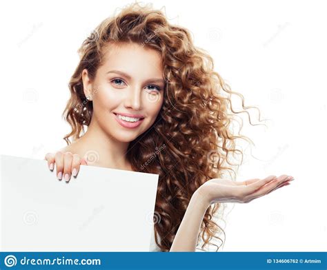 Cheerful Woman With Open Hand And White Empty Board Background With