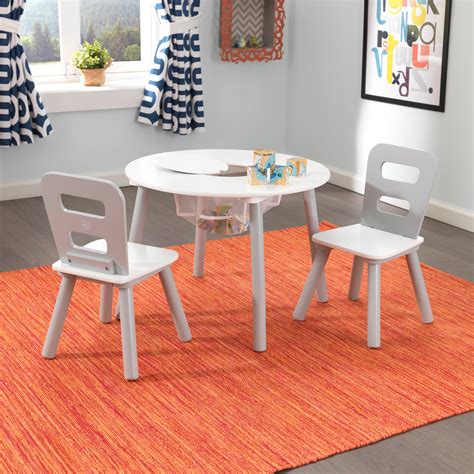 The melissa & doug solid wood table & chairs set is an easy to assemble set that has been sized for kids from ages 3 to 8 years. KidKraft 3 Piece Round Storage Table and Chair Set - Kids ...