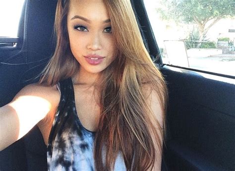 beautiful asian girls take selfies in the car