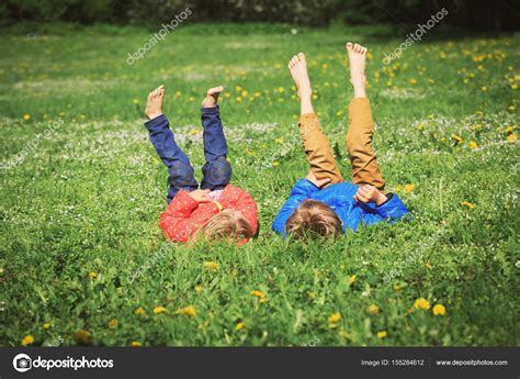 Little Boy And Girl Relax On Green Grass — Stock Photo © Nadezhda1906