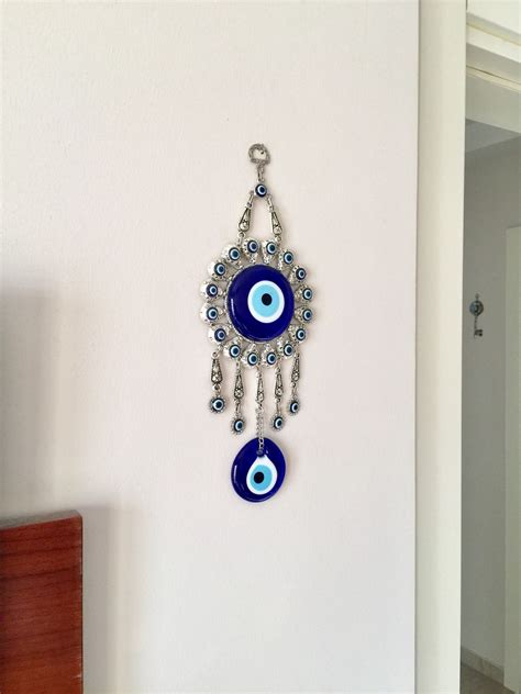 Evil eye wall hanging, macrame evil eye wall hanging, evil eye home decor, greek evil eye bead, turkish evil eye, wood beads, blue evil eye 🌟 please choose main bead size during checkout; Silver Evil Eye Wall Hanging, Metal Evil Eye Home Decor ...