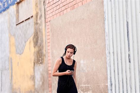 Stylish Girl In Headphones Listening To Music By Stocksy Contributor Guille Faingold Stocksy