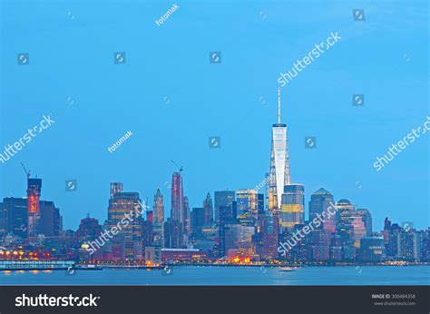 New York City Skyline Sunset Illuminated Stock Photo 300484358