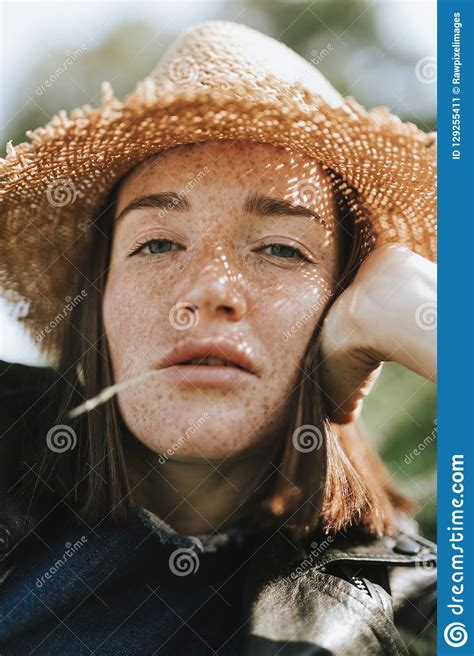 Portrait Of A Beautiful Young Woman With Freckles Stock