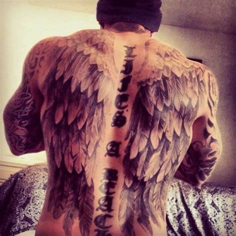 Done in black ink, the detailed wing is intricate, realistic, and bold. Wing Tattoos for Men - Ideas and Designs for Guys