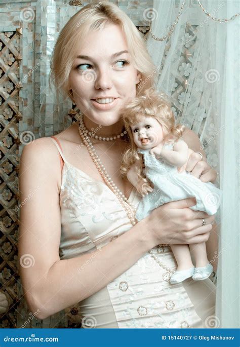 The Blonde With A Doll3 Stock Image Image Of Model People 15140727