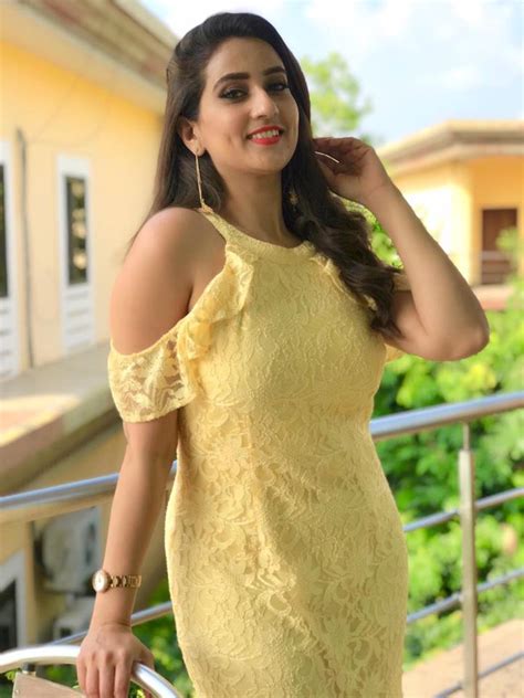 glamorous telugu tv girl manjusha hot gallery in sleeveless yellow dress tollywood boost