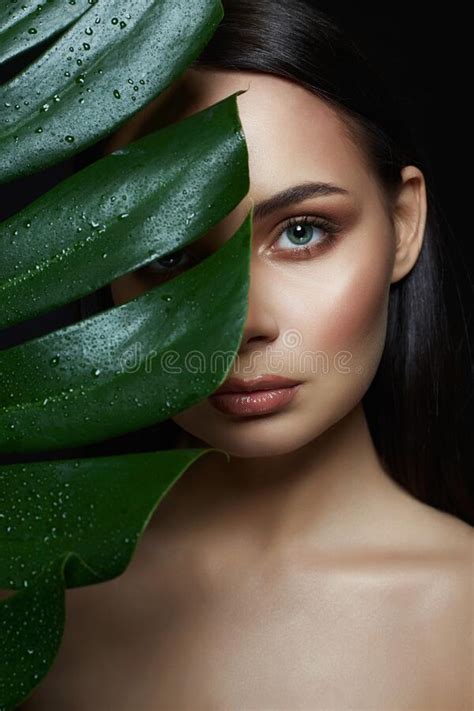 Beautiful Girl In Palm Leaves Beautiful Young Woman With Make Up Stock