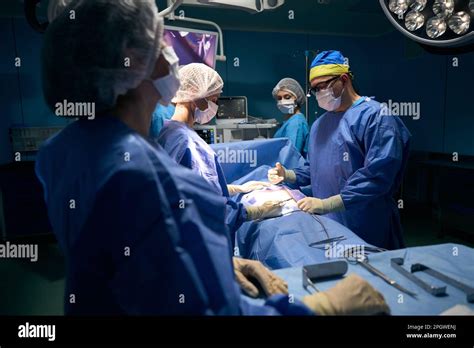 Patient Under Anesthesia Lies On The Operating Table Stock Photo Alamy