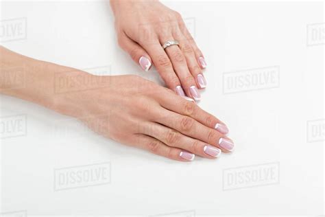 Close Up View Of Beautiful Female Hands With French Manicure Isolated