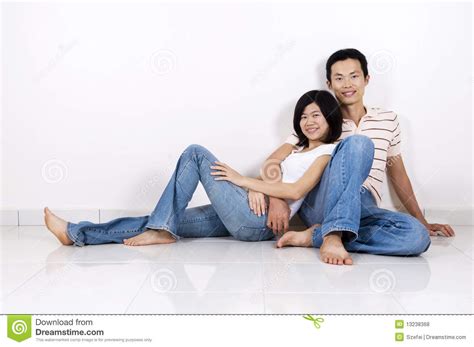 Couple Sitting On Floor At Home Stock Photo Image Of Date Embrace