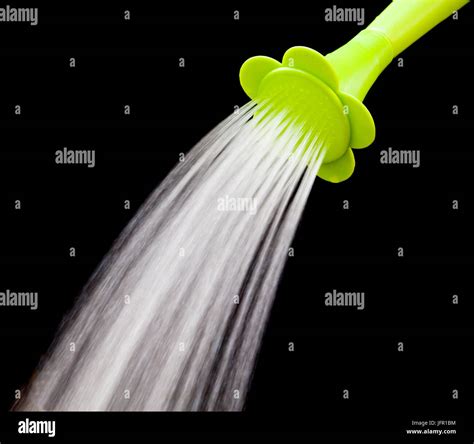 File Of Green Watering Can Pouring Water With Slow Speed Shutter
