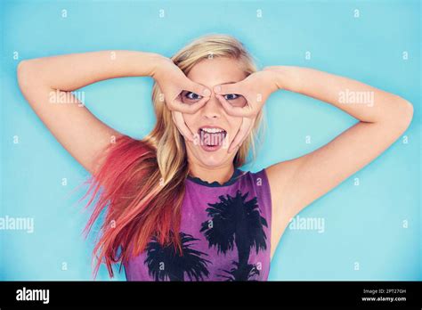 High On Life An Attractive And Trendy Young Woman Posing Playfully In