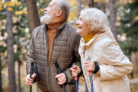 Elderly Couple Having Fun While Walking Together In Park Romantic