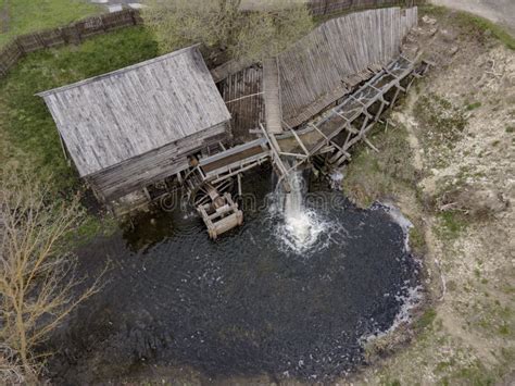 Water Mill Wheel Rotates Under A Stream Of Water Traditional Village