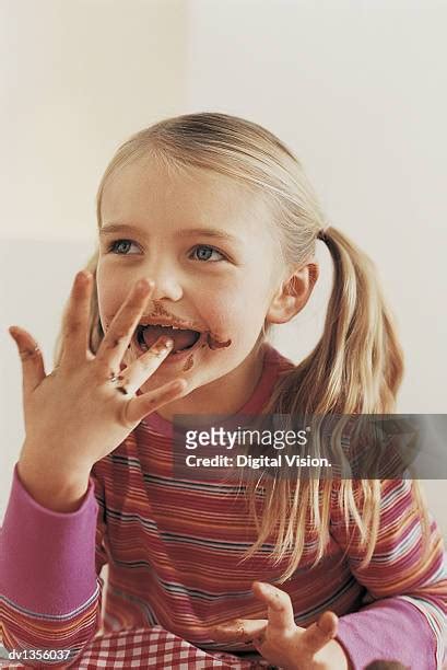 blonde girl licking stockfoto s en beelden getty images
