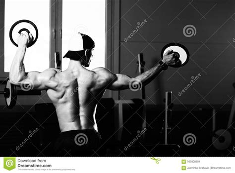 Handsome Muscular Man Flexing Muscles With Weights Stock Image Image