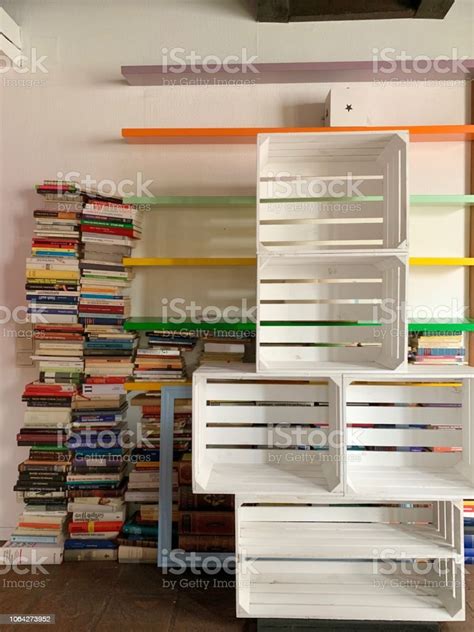 Planning The New Library Unsorted Book Stacks And Empty Shelves Stock