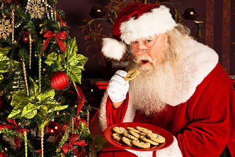 Santa Eating Cookie Stock Photos Pictures And Royalty Free Images Istock