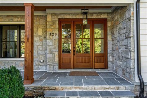 Front Covered Porch With Blue Stone Real Wood Front Door With Glass