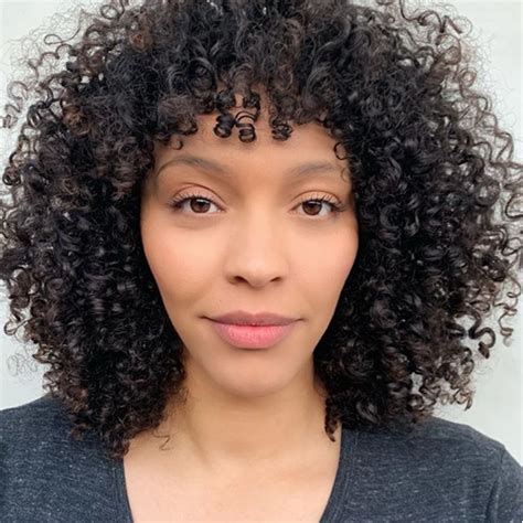 Unfortunately, curls don't work that way. 3 Tips For Cutting Bangs On Curly Hair behindthechair.com