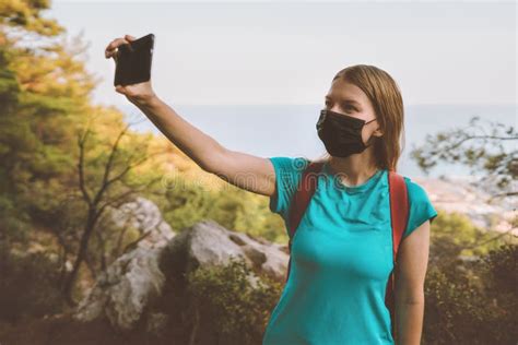 Woman In Face Mask Taking Selfie By Smartphone Coronavirus Pandemic