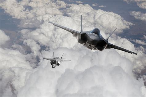 F35 Fighter Jet Flying Over The Clouds Stock Photo Download Image Now