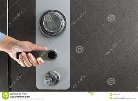 Hand opening a safe stock image. Image of lock, metal - 22429917
