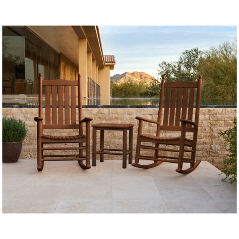 Modern teak sets have a teak outdoor bench on one side instead of chairs. McGavin 3-Piece Rocking Chair Set in Teak | Costco Australia
