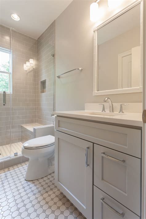 Beige And White Guest Bathroom Featuring Beige Subway Tile And Built In