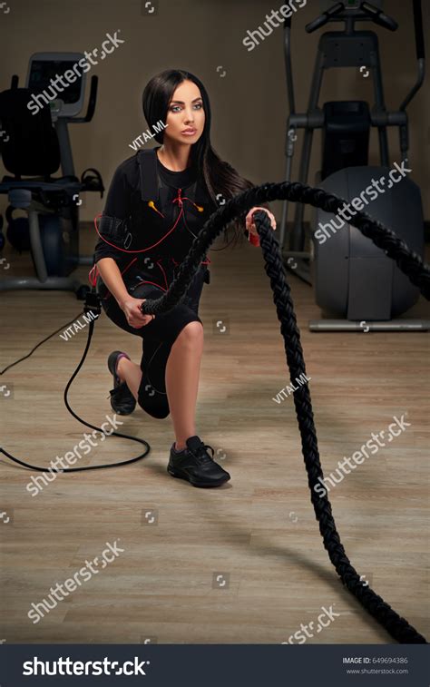 Electrical Muscular Stimulation Fitness Brunette Woman Stock Photo