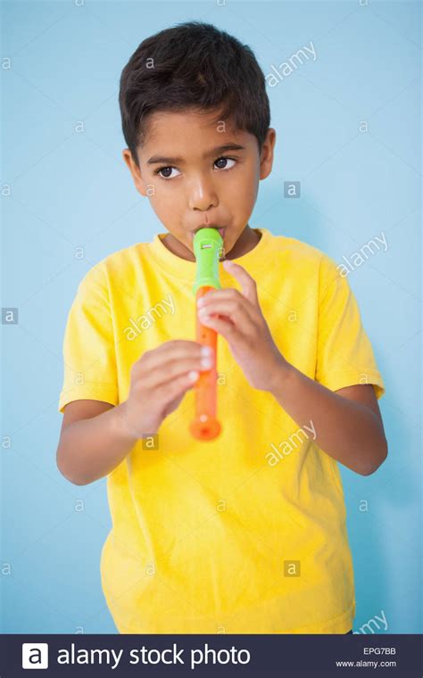 Cute Little Boy Playing The Recorder In Classroom Stock Photo Alamy