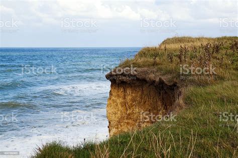 Overhanging Cliff Edge And North Sea Stock Photo Download Image Now