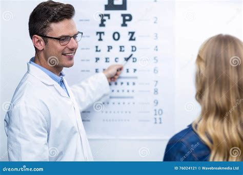 Optometrist Taking Eye Test Of Female Patient Stock Image Image Of