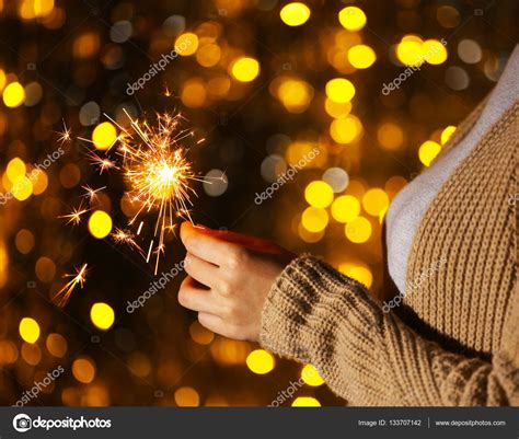 Woman Holding Sparkler — Stock Photo © Belchonock 133707142