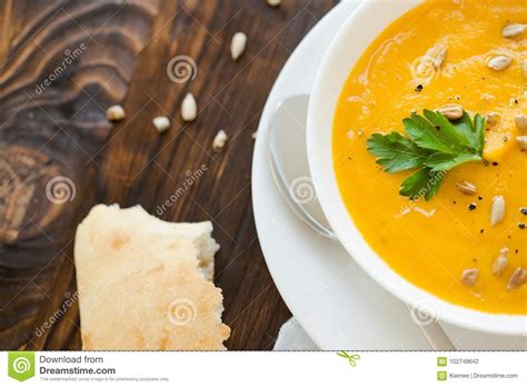 Dinner With Carrot Soup Puree Served In White Bowl Stock