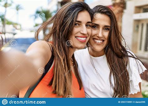 Two Latin Girls Smiling Happy Make Selfie By The Smartphone At The City Stock Image Image Of