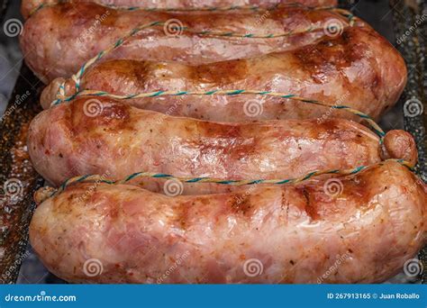 Close Up Of Grilled Chorizos On A Cuting Board Typical Argentine