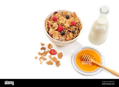 Healthy Breakfast With Bowl Of Cereal Milk And Honey Stock Photo Alamy